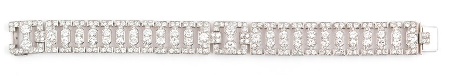 Cartier, London. An Art Deco diamond bracelet with articulated geometric panel links