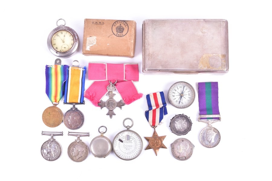 A group of militaria and medals comprising a group of WWI medals and WWII medals