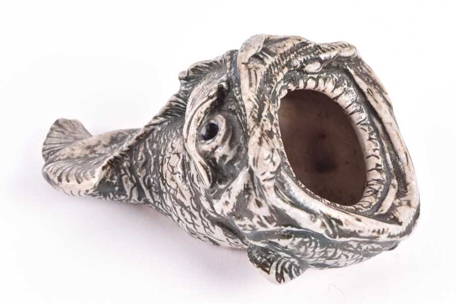 A Martin Brothers spoonwarmer modelled as a grotesque fish 