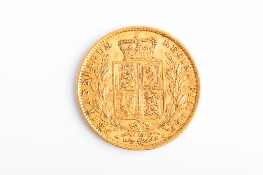 A Victorian 1865 22ct gold full sovereign with shield back.