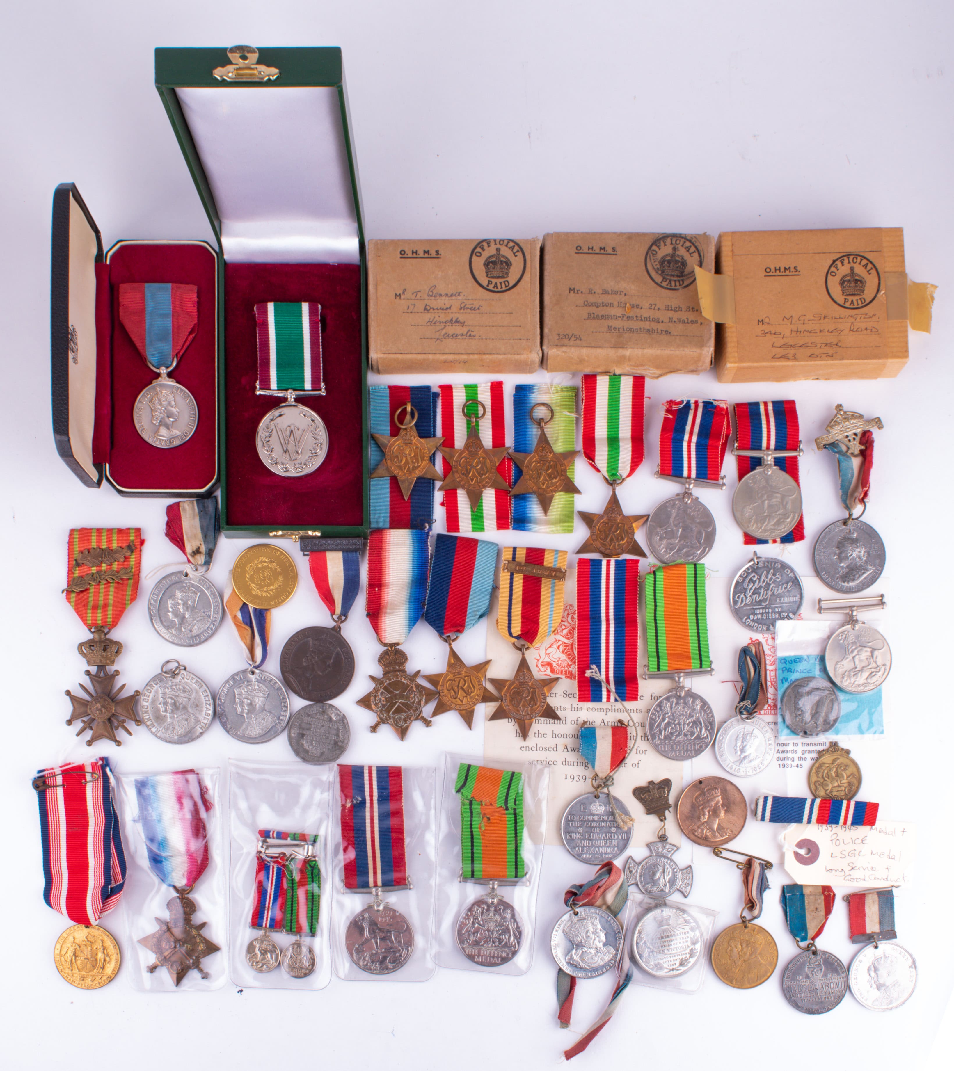 A collection of WWII medals in original boxes