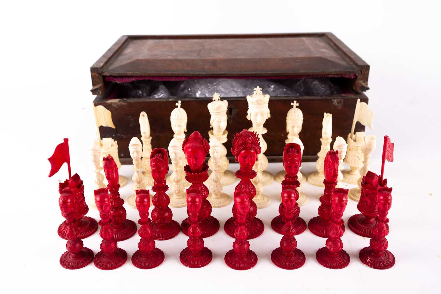 A rare Chinese Canton carved natural and stained ivory figural chess set, 19th century European King Queen buildings carved Chinese Emperor Empress oriental landscapes stems carved foliate knops