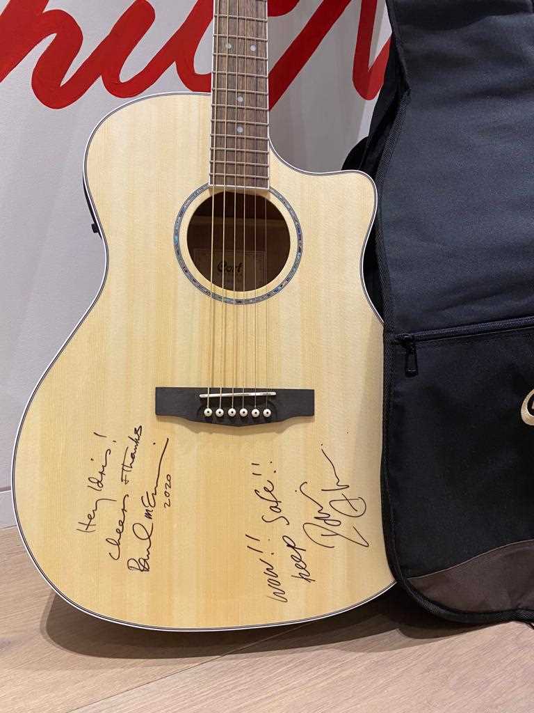 A Unique Cort acoustic guitar signed by Sir Paul McCartney and Idris Elba raising funds for S.T.O.R.M. Charity. Sold for £10,500.