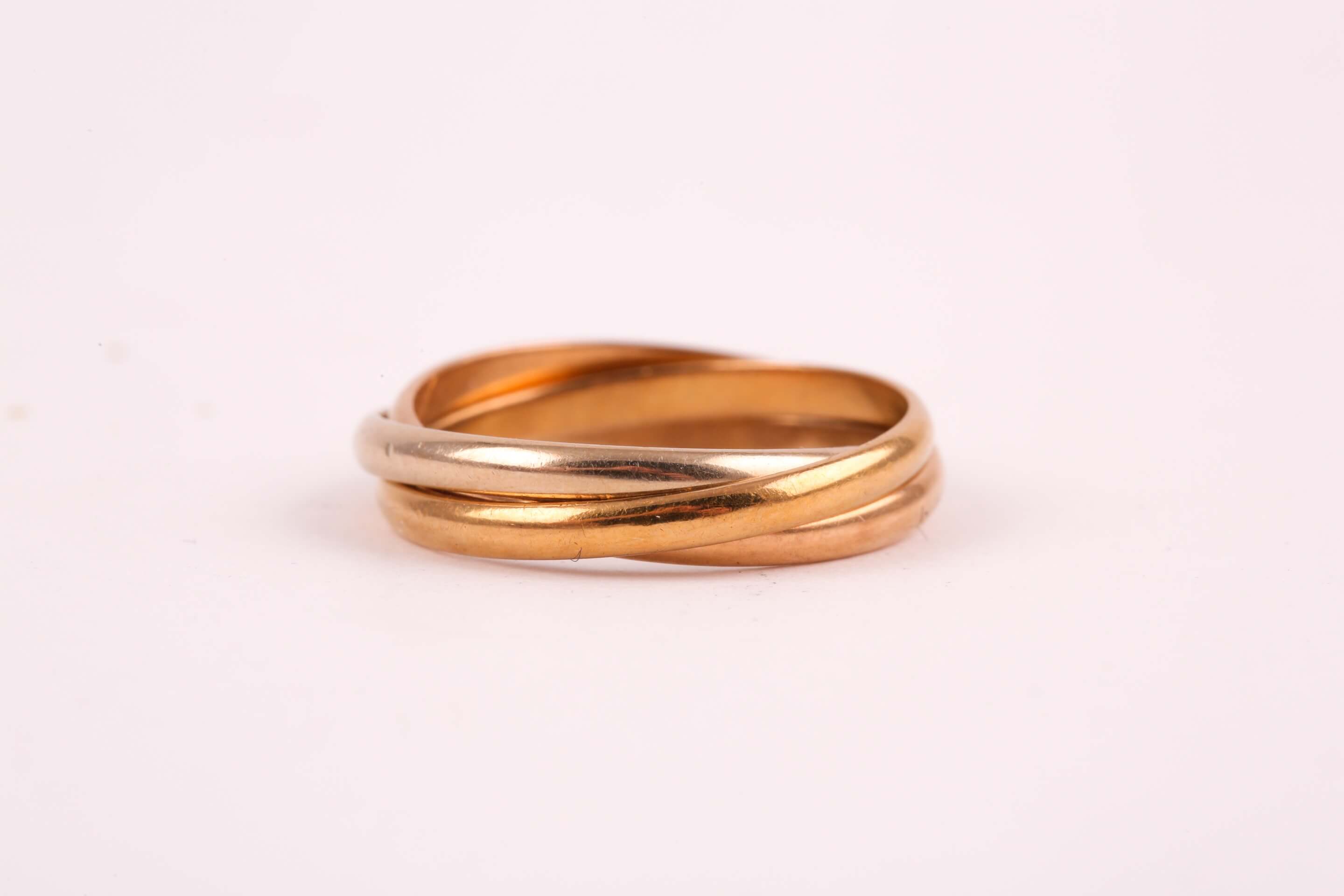 A Cartier 'Trinity' three colour gold ring