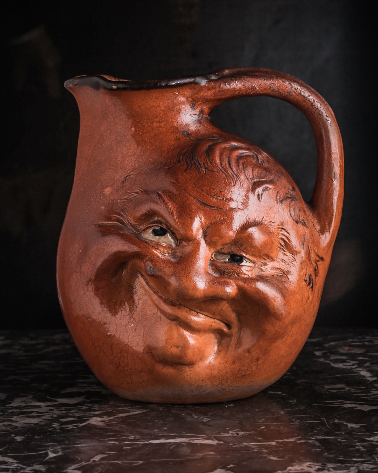 A Martin Brothers large double-sided stoneware face jug