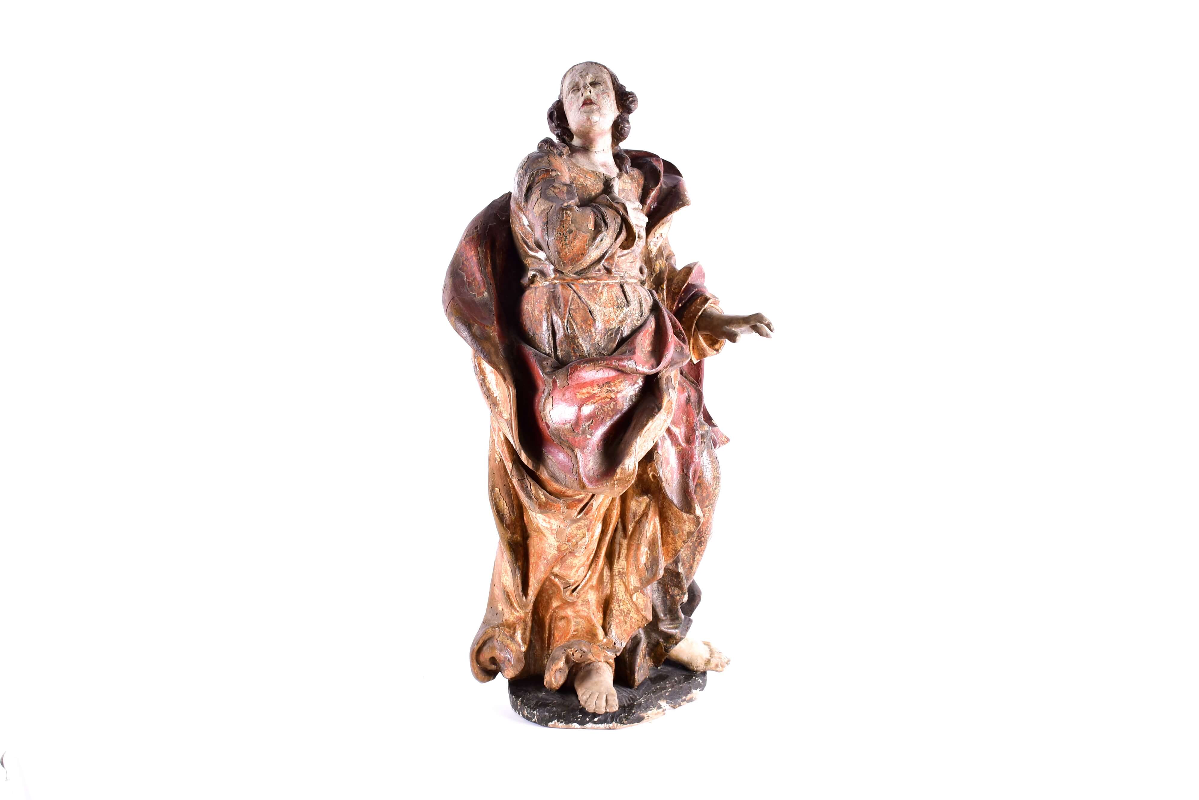 A 16th century late Baroque limewood figure of a saint