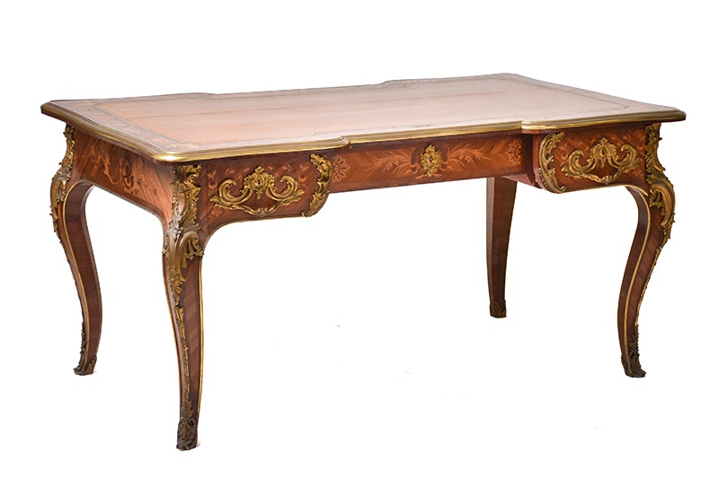 A French Louis XV style rococo marquetry and Kingwood bureau plat