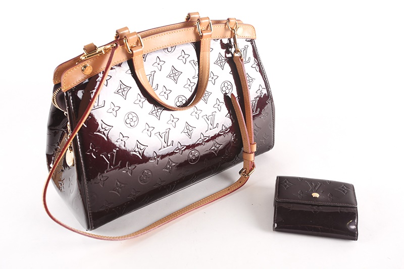 A Louis Vuitton dark maroon patent leather handbag