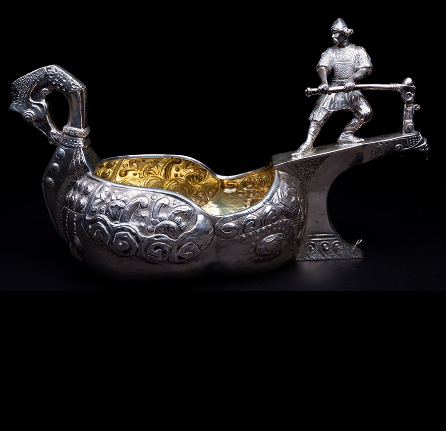 A large Russian silver Norse inspired kovsh. Sold for £4,500.