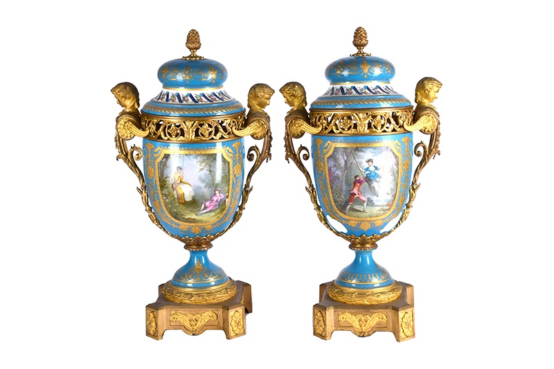 A large pair of Sevres ormolu mounted pedestal vases and covers