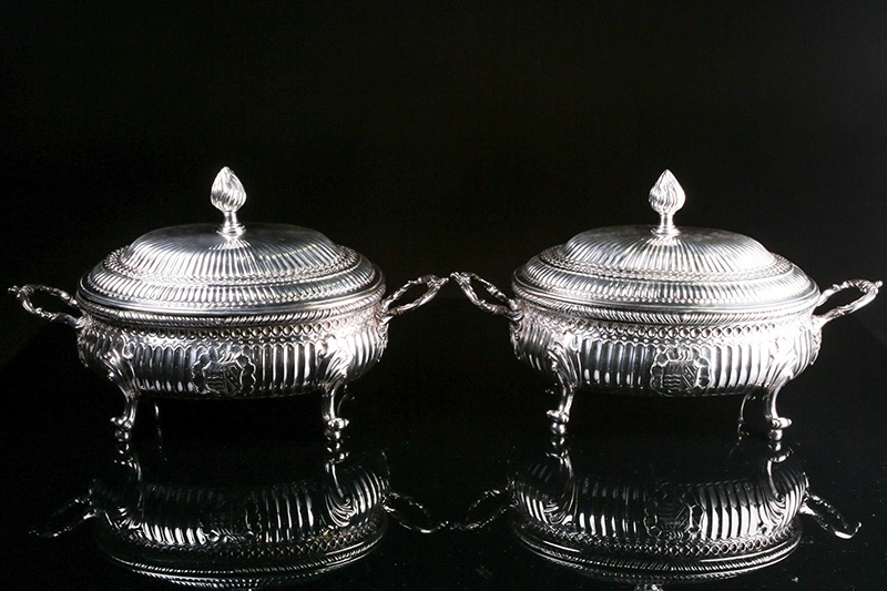 A pair of mid 18th century Irish silver soup tureens and covers