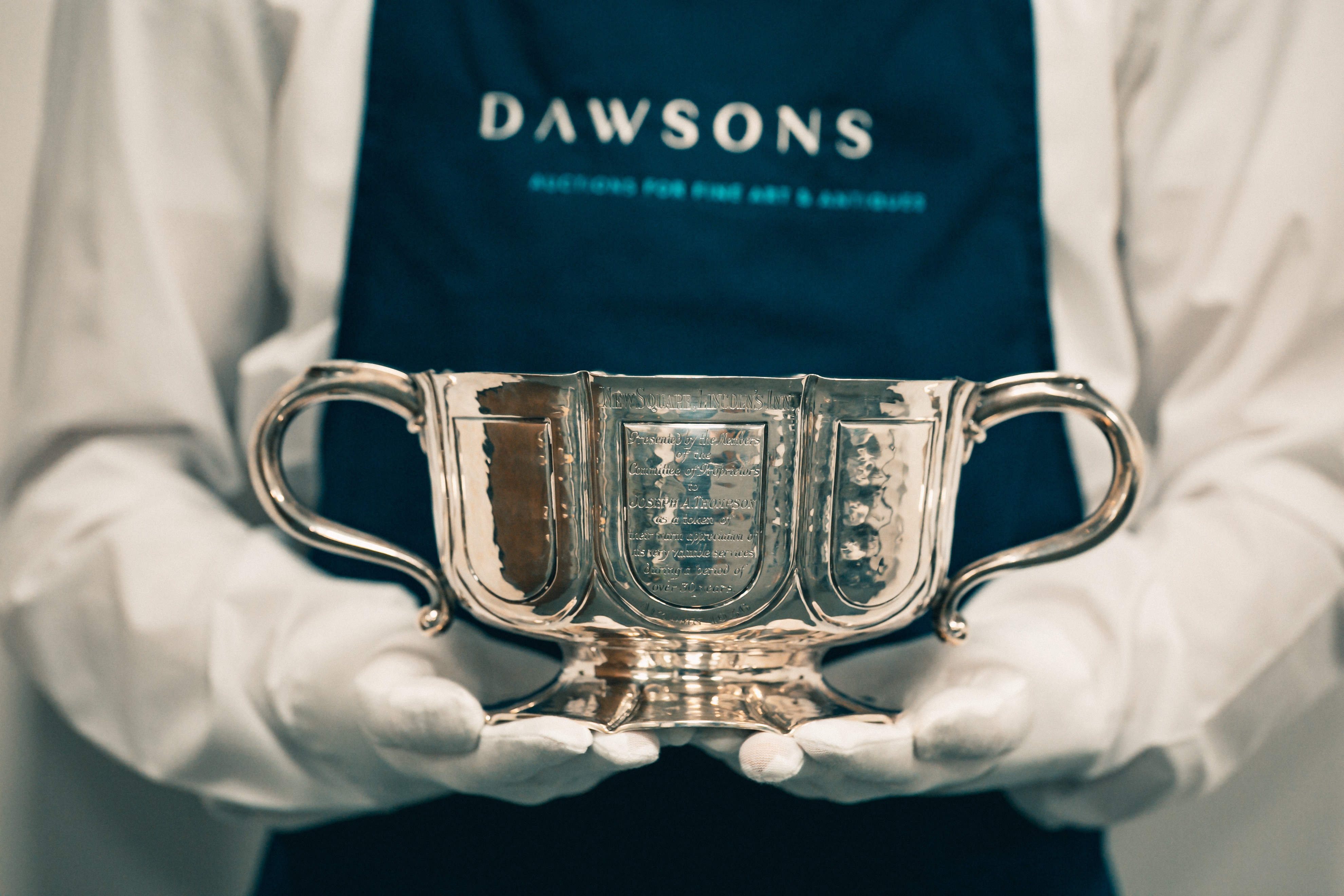 silver bowl held by Dawsons porter