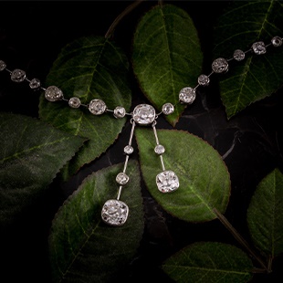 An antique collet-set diamond lavliere necklace