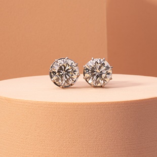 A pair of diamond stud earrings