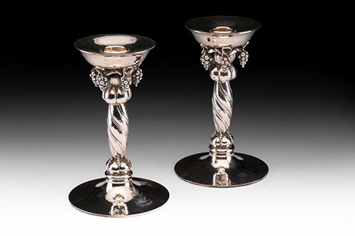 A pair of Georg Jensen Grape pattern Sterling candlesticks