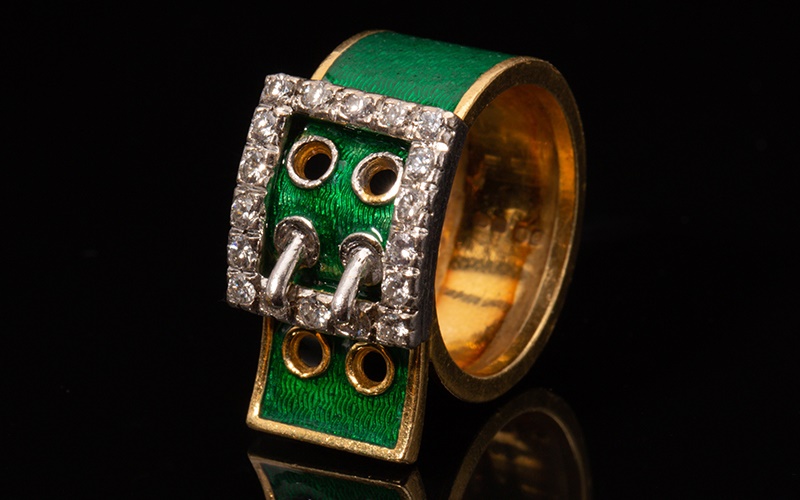 A Kutchinsky enamel and diamond-set belt buckle ring
