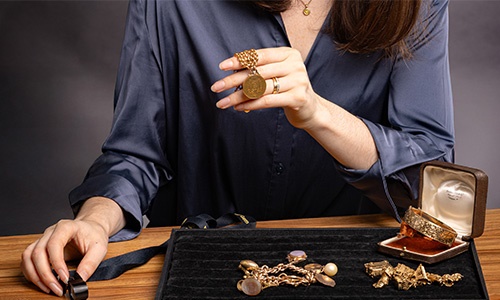 Niamh Thomas with tray of gold jewellery