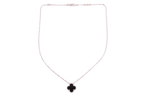 Van Cleef & Arpels - an 18ct white gold and onyx 'Alhambra' pendant on chain