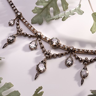 A late Victorian diamond garland necklace featuring a central cushion shape old cut diamond, estimated weight of 2.50ct