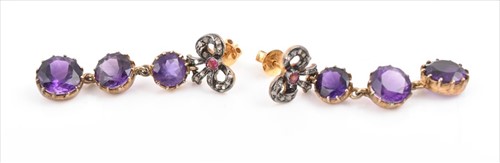 Lot 724 - A pair of diamond and amethyst drop earrings...
