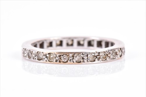 Lot 547 - A diamond eternity ring pave set with small...