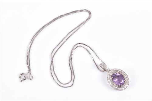 Lot 625 - An 18ct white gold, diamond, and amethyst...