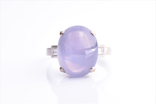 Lot 492 - A diamond and star sapphire ring set with a...