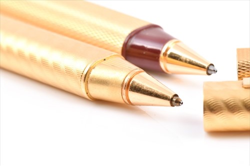 Lot 226 - Cartier. Two similar gold plated pens both...