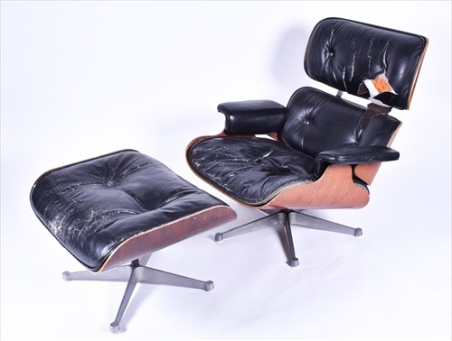Lot 33 - An Eames-style lounge chair and matching...