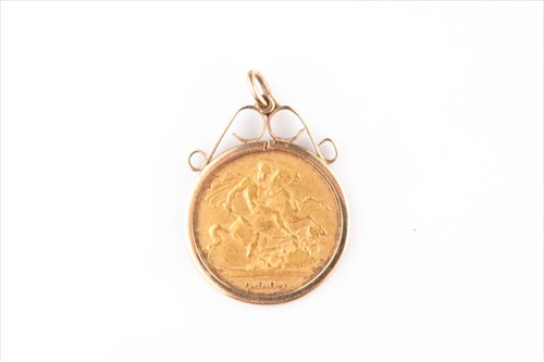 Lot 384 - A 1901 half sovereign with yellow metal mount...