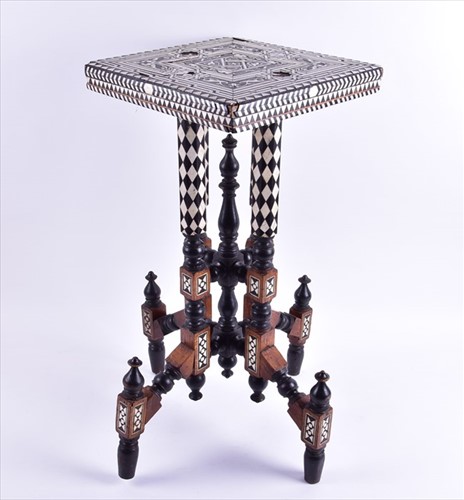 Lot 143 - A turn of the century Moroccan inlaid table...