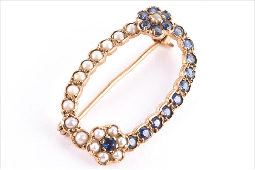 Lot 421 - A 9ct yellow gold, sapphire, and split seed...