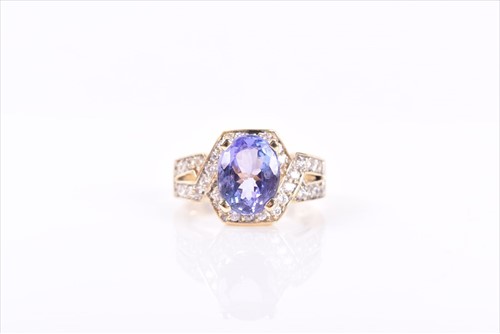 Lot 545 - A diamond and tanzanite ring set with a mixed...