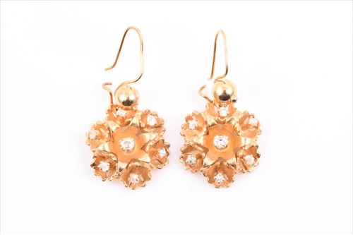 Lot 564 - A pair of 14ct yellow gold and diamond floral...