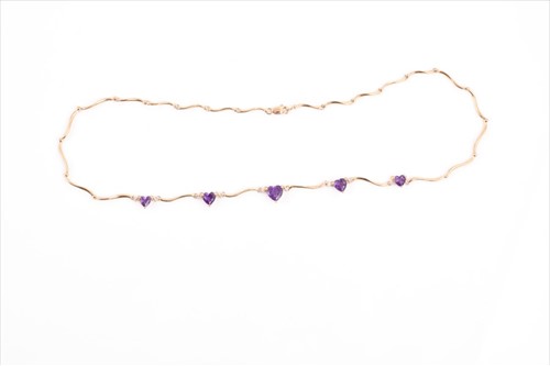 Lot 503 - A yellow gold, diamond, and amethyst necklace...
