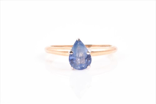 Lot 594 - A yellow gold and sapphire ring set with a...