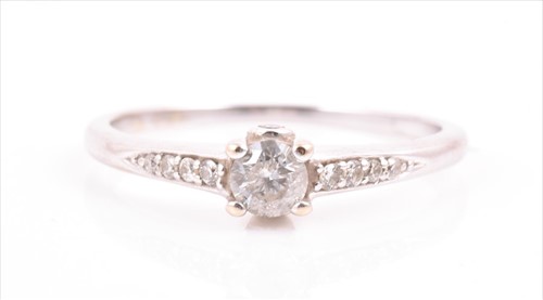 Lot 521 - An 18ct white gold and diamond ring set with a...