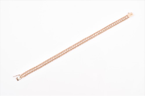 Lot 515 - A yellow metal and diamond line bracelet the...