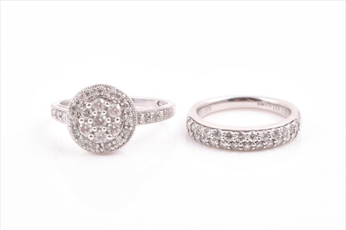 Lot 519 - A 9ct white gold and diamond cluster ring set...