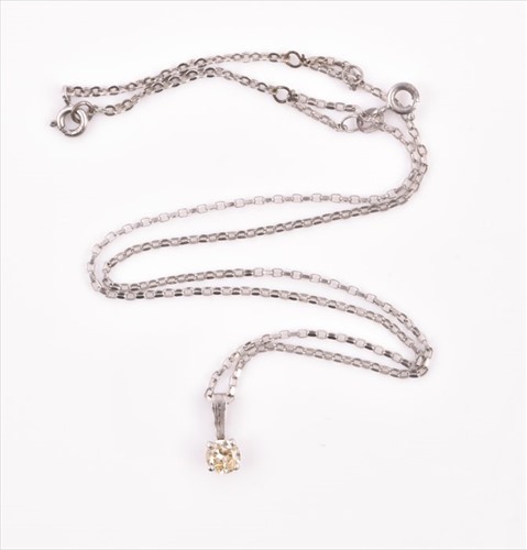 Lot 518 - A solitaire diamond pendant the round...