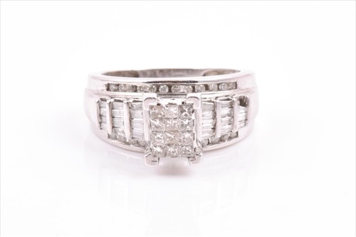 Lot 502 - An unusual white gold and diamond cluster ring...