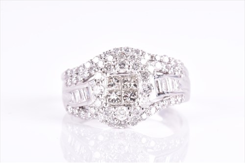 Lot 612 - A diamond cocktail ring set with small...