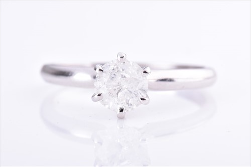 Lot 615 - A solitaire diamond ring set with a...