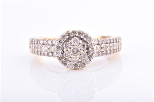 Lot 464 - A yellow metal and diamond dress ring centred...