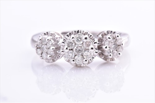 Lot 542 - A white metal and diamond ring set with three...