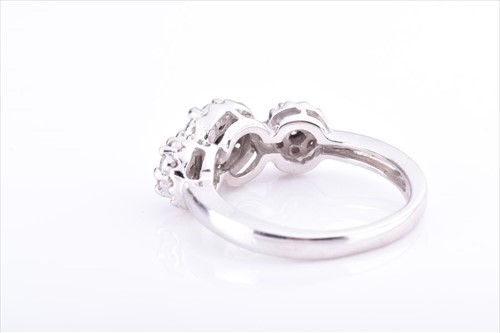 Lot 542 - A white metal and diamond ring set with three...