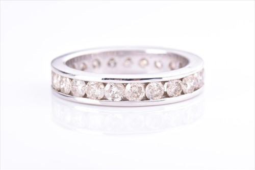 Lot 544 - A diamond eternity ring the white metal mount...