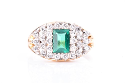 Lot 605 - A yellow metal, diamond, and green stone ring...