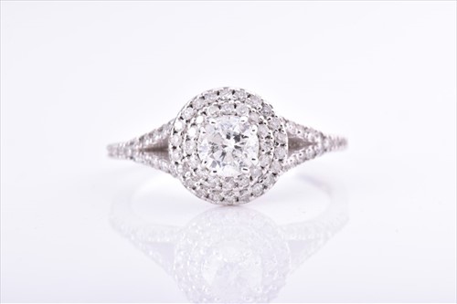 Lot 457 - A diamond double halo ring centred with a...