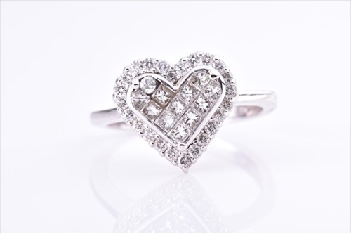 Lot 614 - An unusual diamond heart ring the heart-shaped...